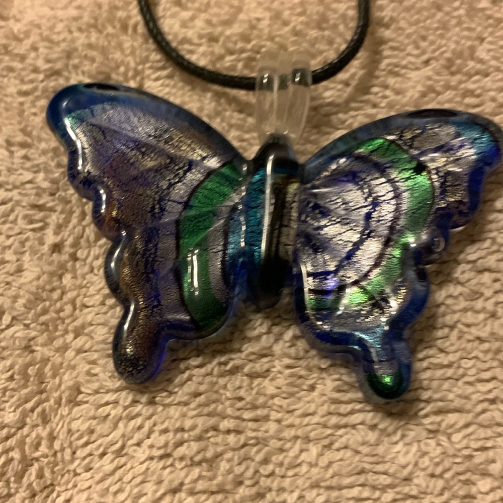 Multi colored glass butterfly necklace on a 24in cord